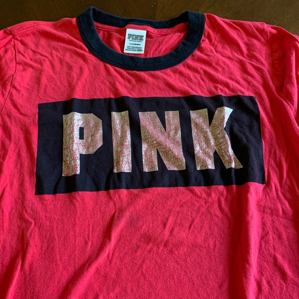 red and black long sleeve shirt from pink